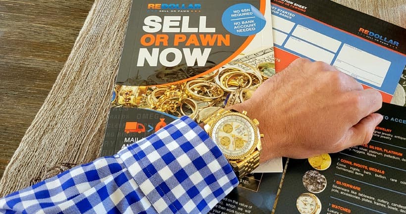 An 18k gold Breitling Navitimer watch along with reDollar selling documents